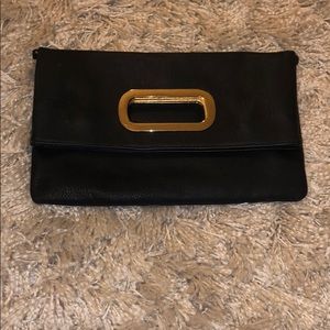 Aldo black and gold clutch